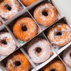 Corporate box of 24 gluten-free, vegan ring doughnuts