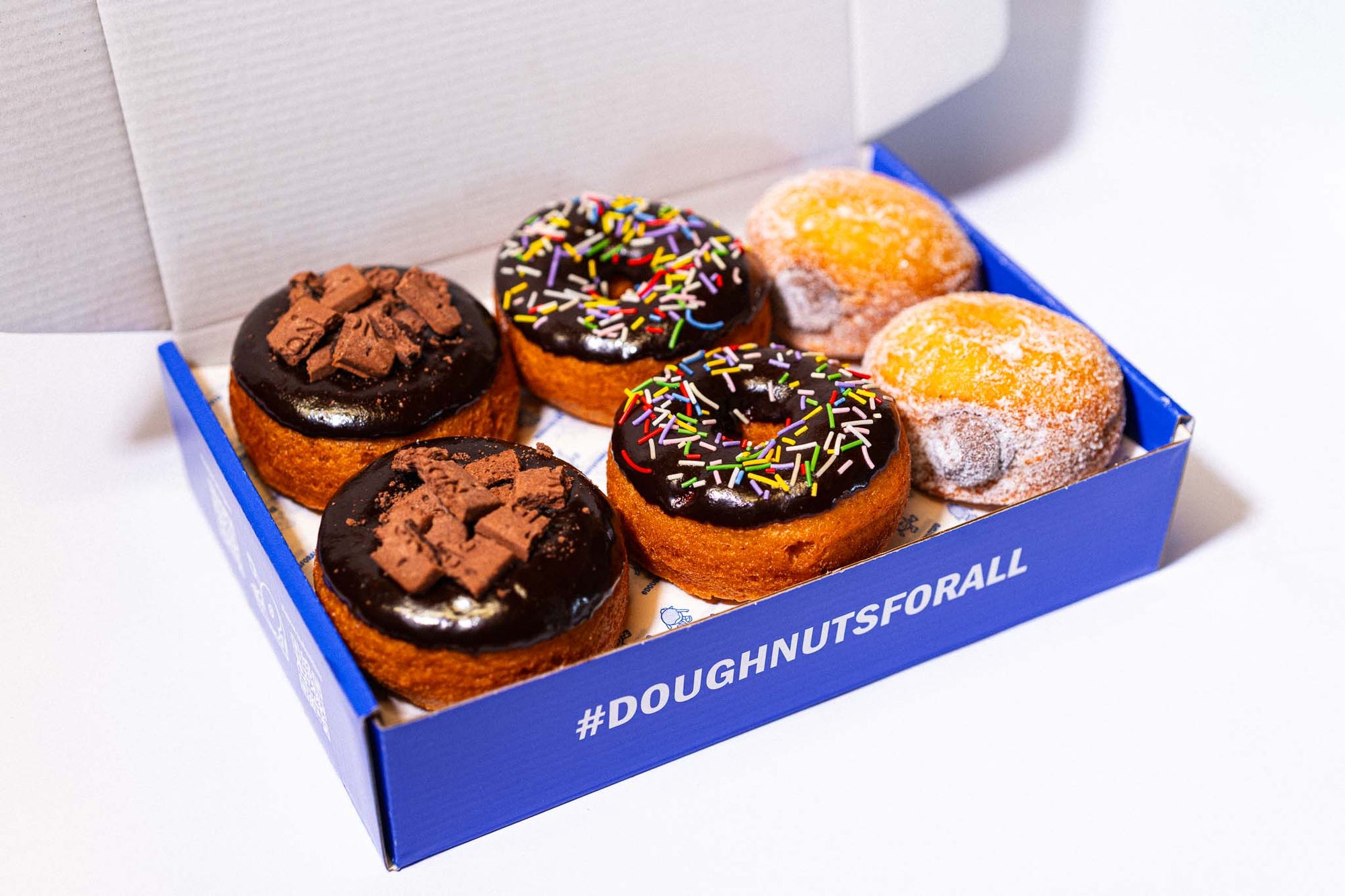 Box of gluten-free, vegan chocolate doughnuts