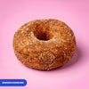 Gluten free vegan fried ring doughnut rolled in cinnamon sugar
