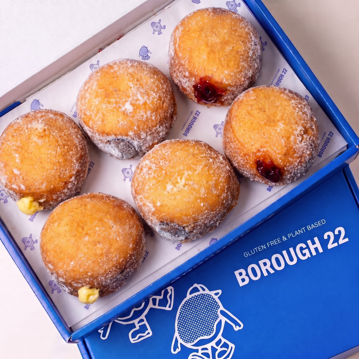 Open Borough 22 box of six gluten free oat free vegan fried sugared filled doughnuts, custard, raspberry jam and chocolate fillings visible at the sides